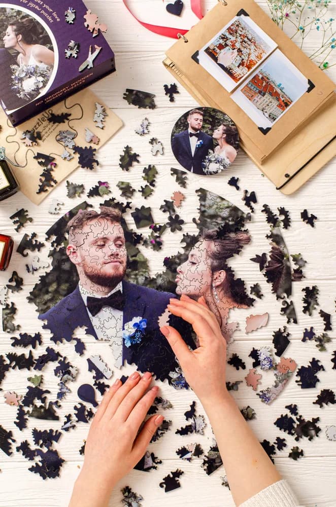 Example: wooden photo puzzle of a wedding couple being assembled by hand