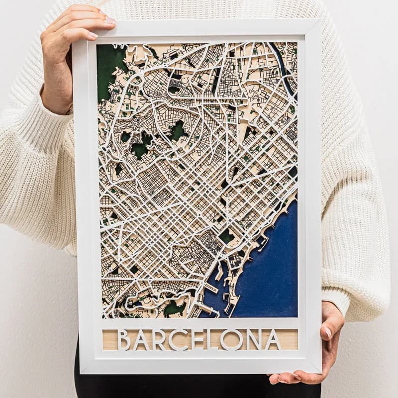 Example: 3D wooden city map of Barcelona in a white frame, held in two hands