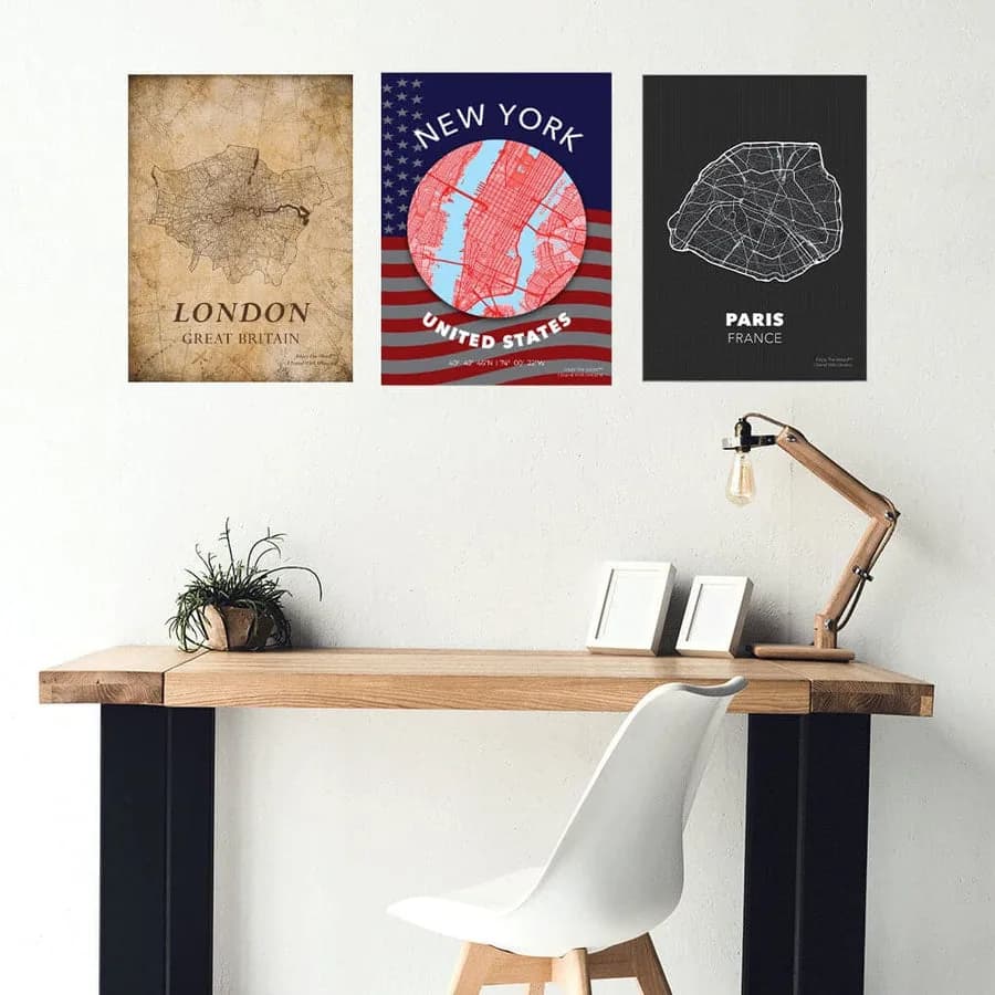 Example: three city map wood posters in vintage, flag, and dark styles above a desk